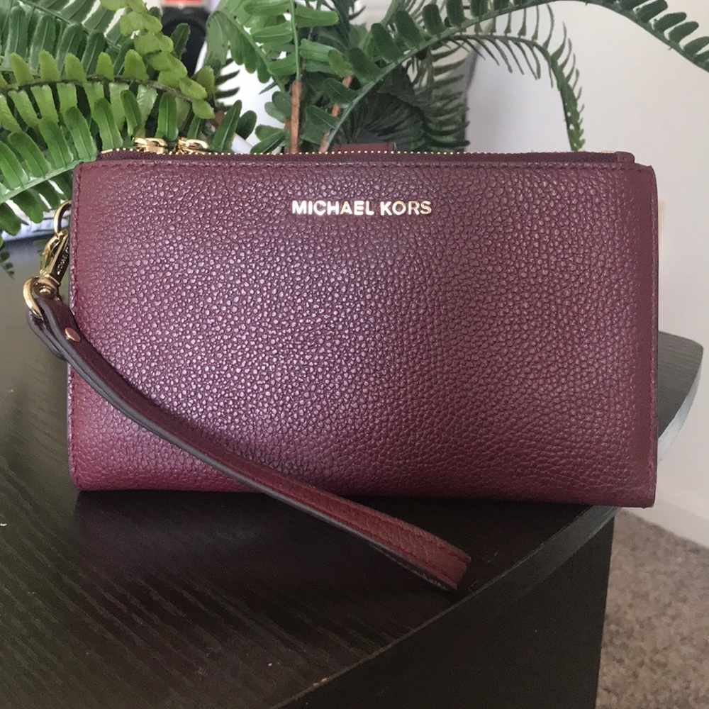 Burgundy Michael Kors smartphone wallet.